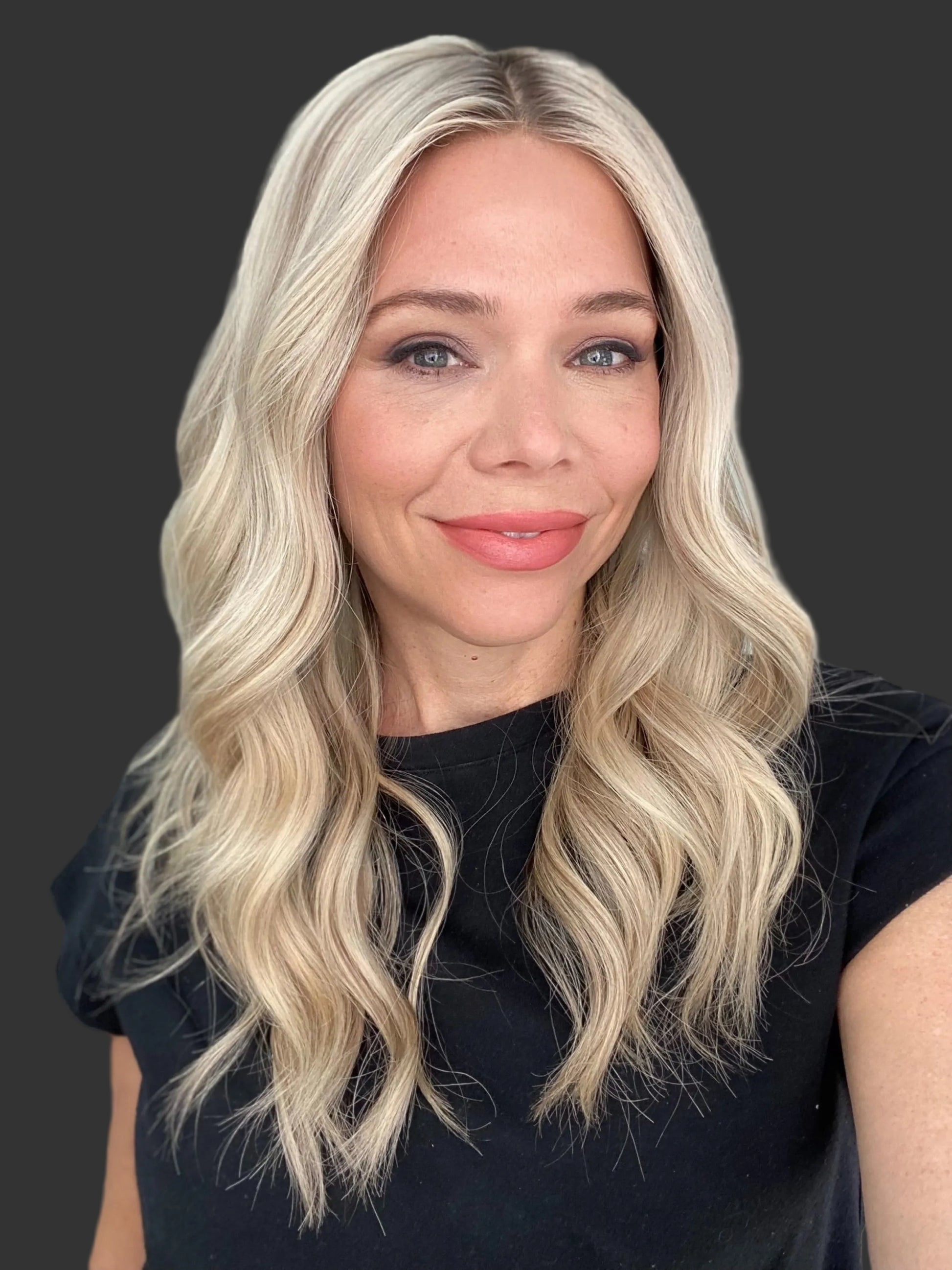 Bright blonde human hair wig with ash rooting. 